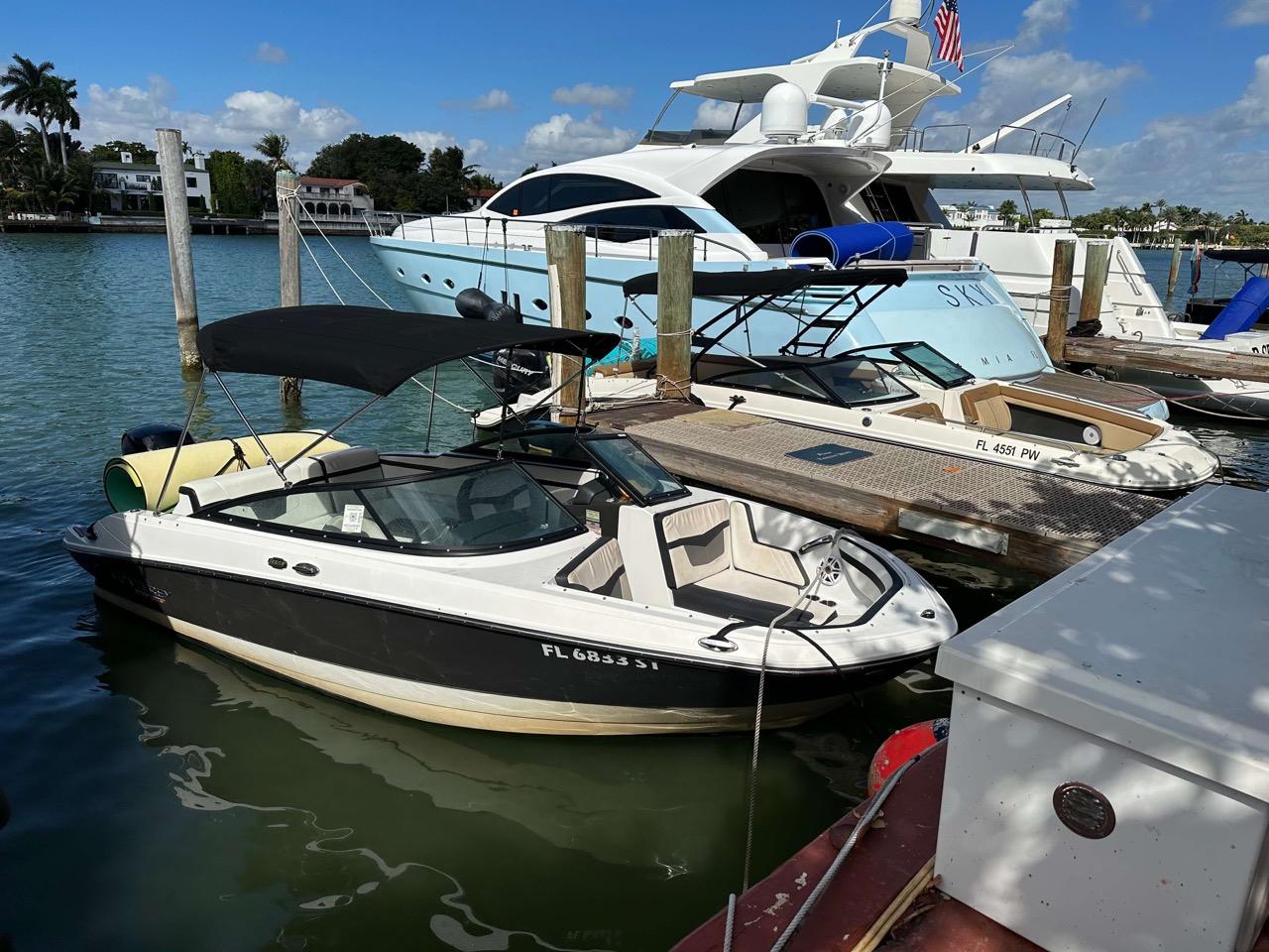 LOOK CLOSELY. This isn't just a photo of 2 boats on the sandbar