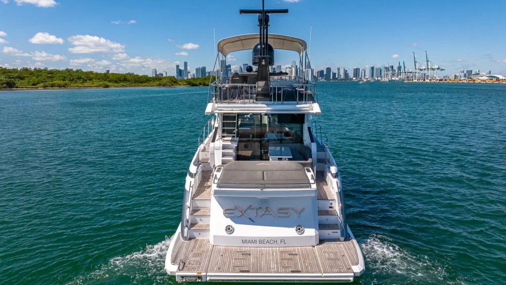 The Best Yacht Rentals In Miami Fl. Azimut 60 Docked With Miami Skyline In The Background, Perfect For Yacht Rental Experiences.